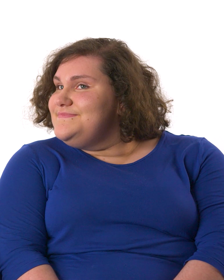 A woman talking and looking into a camera